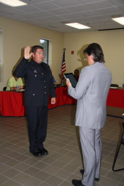 Eric Baron is sworn-in as Firefighter/Paramedic by Trustee Steve Stratakos on August 12, 2014.